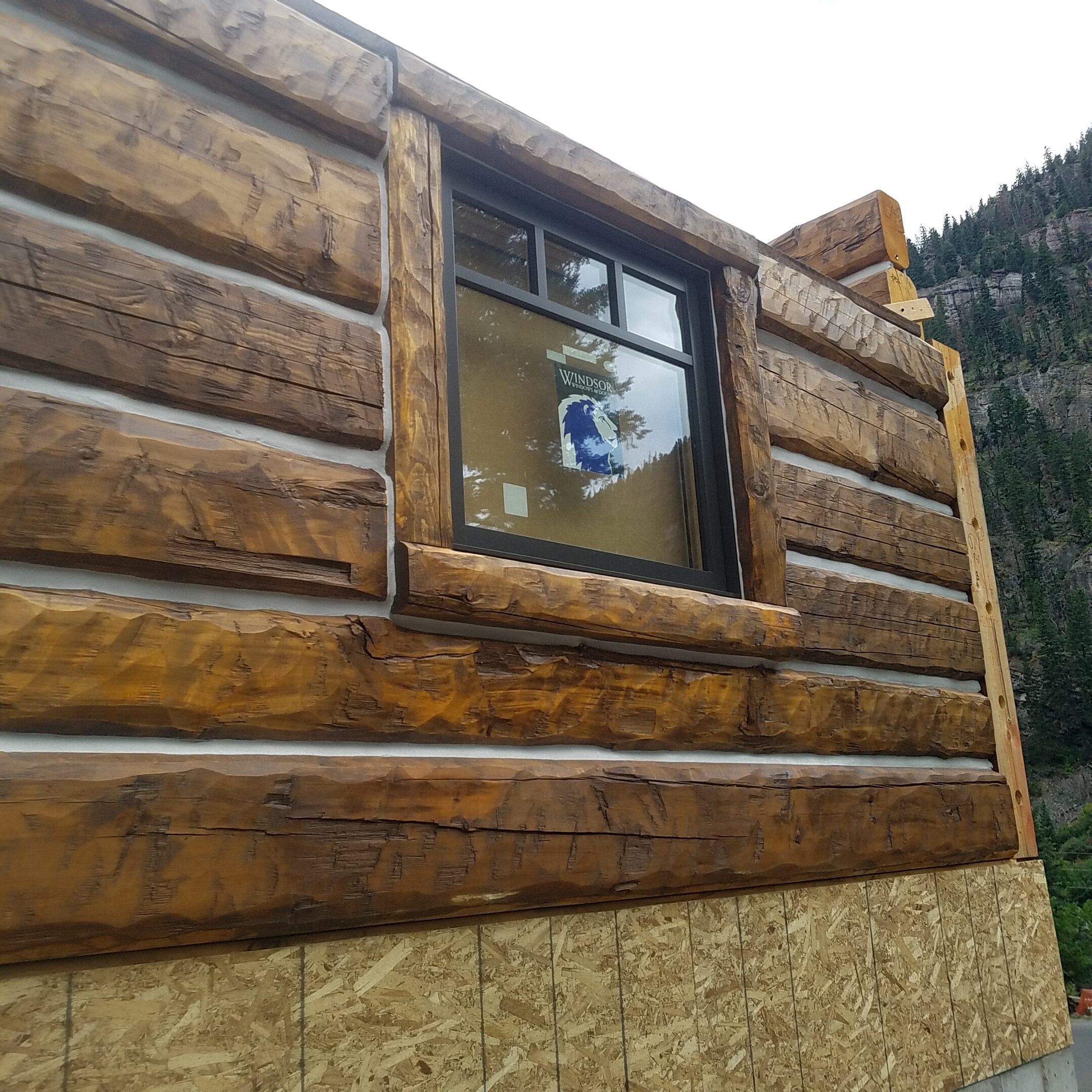 Prebuilt log wall with windows