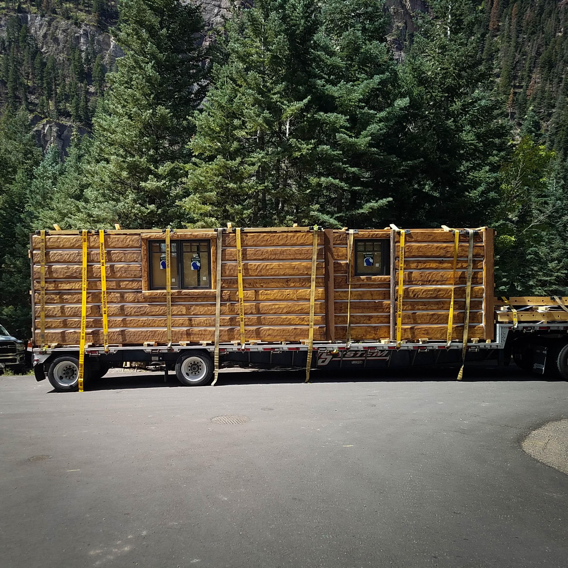 Log wall is delivered and installed in days.